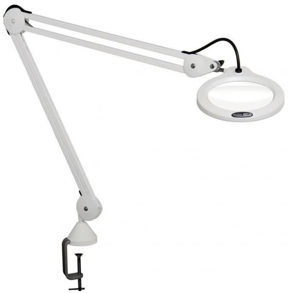 The image shows a white desk lamp with a flexible arm and a large round lens. It is attached to the desk with a clamp and provides bright light for precise tasks.