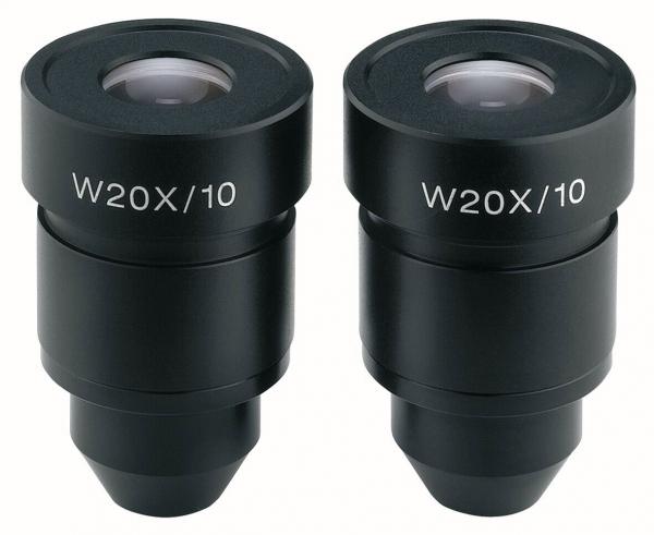 The image shows two black microscope eyepieces. They are cylindrical, have a clear lens on top, and are labeled "W20X/10". The eyepieces are positioned next to each other.