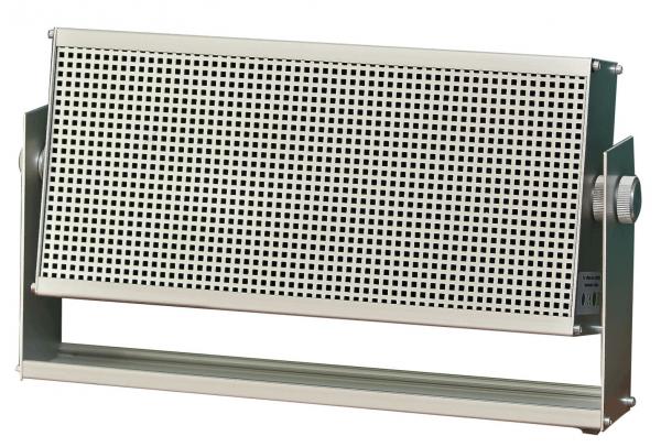 The image shows a rectangular metallic speaker with a perforated grille on the front. It has a simple gray color and is mounted on a sturdy base.