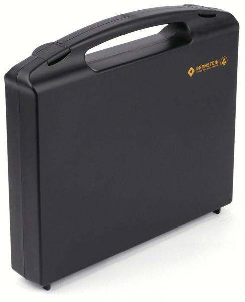It is a black, rectangular suitcase with a sturdy handle. The surface is smooth and matte, with a small logo in the top right corner.