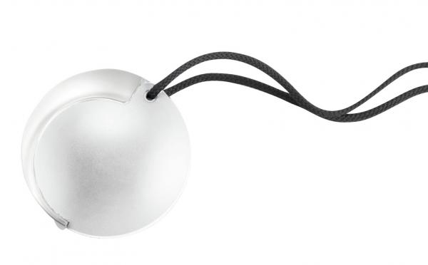 The image shows a shiny, round ball made of metal or plastic, attached to a black cord. The ball has a smooth surface and a small indentation.