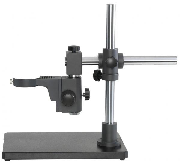 The image shows a microscopic stand with a stable, rectangular base. A vertical, metallic rod supports a swiveling arm with a lens on the left side.