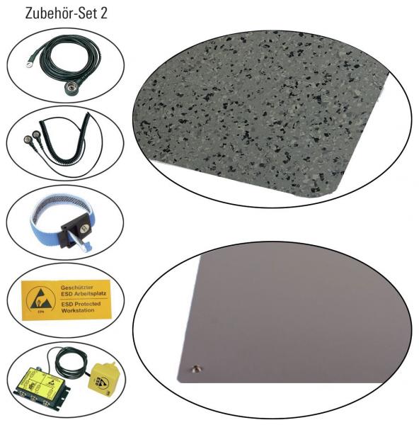 Das Bild zeigt ein Zubehör-Set, bestehend aus variierenden Gegenständen: ein graues Kabel, ein schwarzes Kabel, eine graue Matte mit Sprenkeln, eine Sicherheitsanweisung und weitere Komponenten in ovalen Formen.
