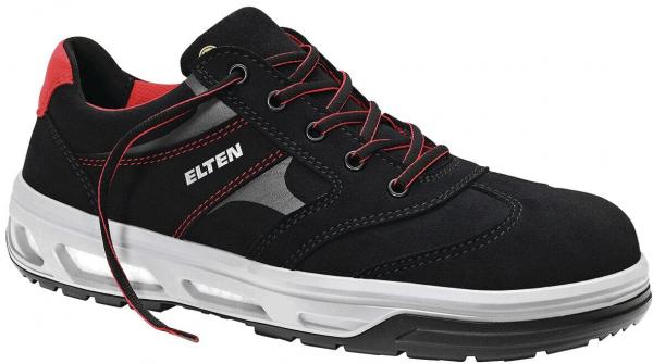 Der Schuh ist ein schwarzer Sicherheitsschuh mit roten Akzenten. Er hat eine stabile Sohle, graue Einsätze und geflochtene Schnürsenkel. Die Form ist sportlich und robust.
