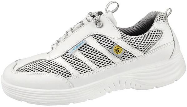 Der Schuh ist überwiegend weiß mit einem atmungsaktiven Netzmaterial. Er hat eine runde Form, eine dicke, gummierte Sohle und seitliche, farbige Akzente. Der Schließmechanismus ist über einen Reißverschluss.