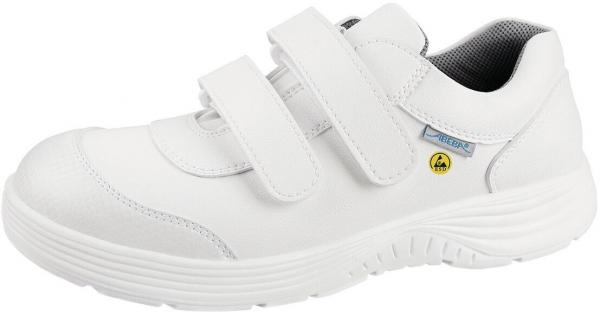 Der Schuh ist weiß, mit einem bequemen, sportlichen Design. Er hat zwei Klettverschlüsse für einfaches An- und Ausziehen und eine strukturierte, rutschfeste Sohle.