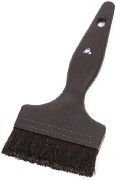 The image shows a brush with a wide, flat head and a black, bristle-like surface. The handle is also black and has an oval shape.