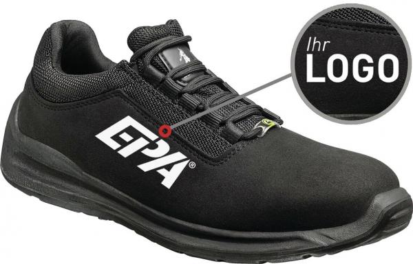 The image shows a black shoe with a simple design. On the side, there is a large, white logo. The shoe features a sporty sole and a padded upper.