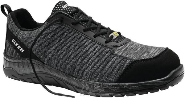 The shoe is black with gray, textured areas. It has a comfortable, low profile, lacing, and a non-slip sole. Ideal for everyday use and light sports activities.