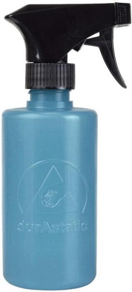 The image shows a blue spray bottle with a black spray head. The bottle has a round shape and is made of plastic. A logo in a light color is visible on the bottle.