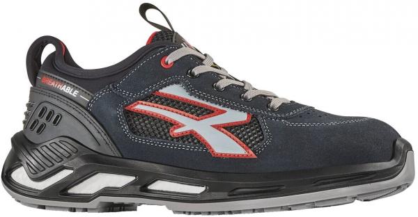 The shoe is a sporty, dark blue half-shoe with gray and red accents. It has a padded sole, laces, and breathable material. The sides feature a special gray logo.