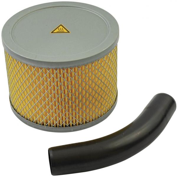 The image shows a round air filter with a gray upper rim and a yellow, pleated filter element, surrounded by a wire-like mesh. Next to it lies a curved, black hose.