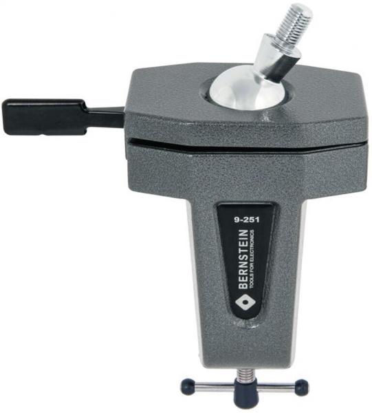 The image shows a gray bracket with a screw mechanism. At the top, there is a round, movable hemisphere attached to a base surface. The side has a lever.