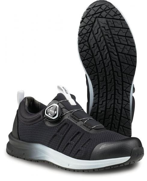The image shows a black sports shoe with an elastic, breathable upper. The sole has a deep pattern for good grip. There is a special closure mechanism on the side.