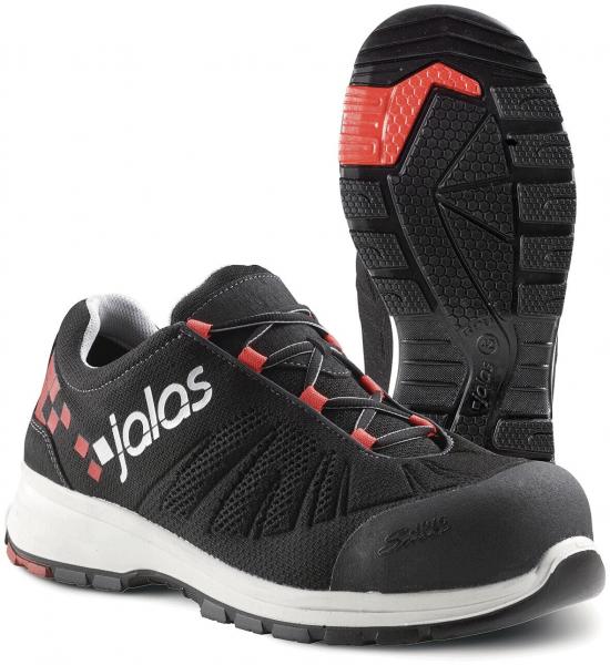 The shoe is black with red accents. It has a modern design, a padded sole, and a grippy rubber sole. The front area is reinforced for added protection.