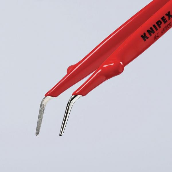 The image shows a red tool with two ends: one has a smooth, curved tip, the other a serrated surface. It could be used for precise tasks.