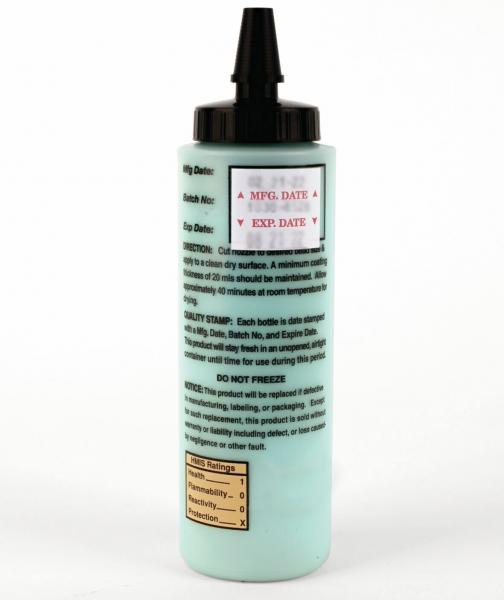 The image shows a bottle with a greenish liquid. It has a black tip and a cap. The bottle has instructions and data printed on it, including storage information.