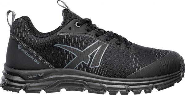 The shoe is a black, athletic running shoe with laces. It has a textured surface and a slightly reinforced sole that provides better grip.