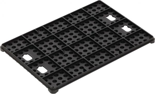 The image shows a black plastic plate with many small holes and rectangular protrusions. The plate is rectangular and has a textured design for stabilization.