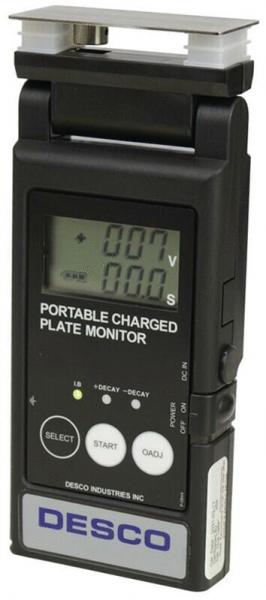 The image displays a portable device for measuring electric charge. It features a digital display with buttons and a top plate for measurement. The color scheme is primarily black.