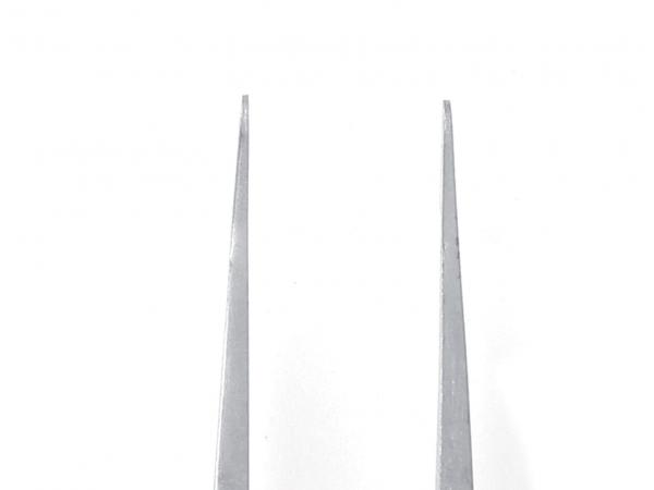 The image shows a straight, silver-colored tweezer with two long, narrow tips arranged parallel to each other. The background is white.