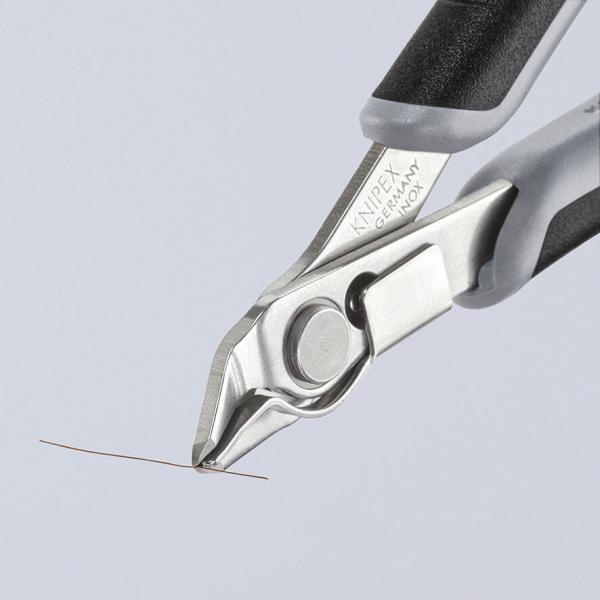 The image shows a pair of pliers with sharp, flattened tips used for cutting thin wire or thread. The handle has a non-slip surface.