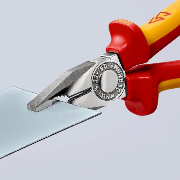 The image shows pliers with red and yellow handles holding a thin glass plate. The pliers have a shiny, metallic surface with precise, serrated edges.