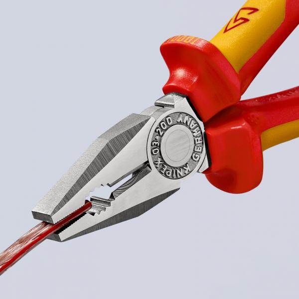 The image shows a pair of pliers with red and yellow handles. The head part is silver-colored and has a flat, sharp edge. The pliers are gripping a thick red wire.