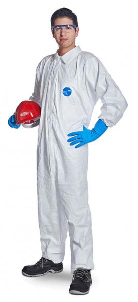 In the picture, there is a person in a white protective suit with blue gloves. They are wearing safety goggles and holding a red helmet in their left hand.