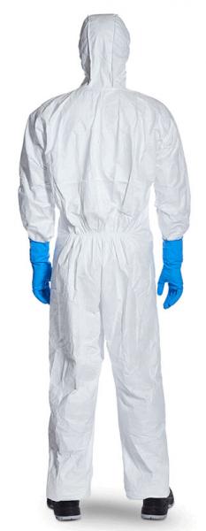 The image shows a person from behind, dressed in a white protective suit with a hood. The hands are in blue rubber gloves. The shoes are black and sturdy.
