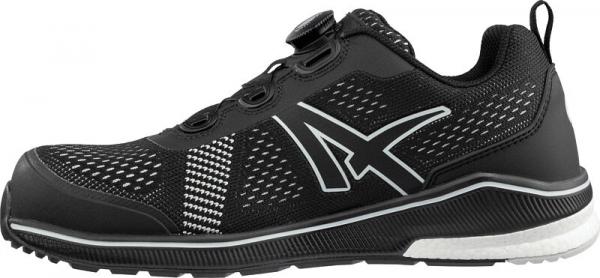 The shoe is black with breathable inserts, a sporty silhouette, and a white sole. It features a modern quick-lacing system and reflective details.