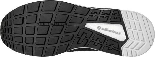 The image shows the sole of a shoe. It is predominantly black with a grid-like pattern that provides grip and slip resistance. A white area is visible on one side.
