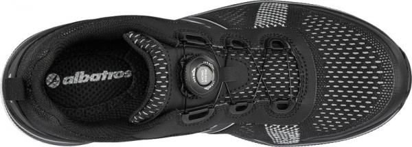 The image shows a black athletic shoe made from breathable material. The lacing is done through a special closure. The lining is also dark, with a white logo.