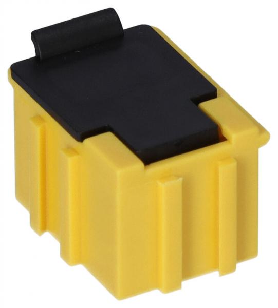 Das Bild zeigt einen kleinen Kunststoffstecker. Er hat eine leuchtend gelbe Farbe mit einer schwarzen Oberseite. Die Seiten sind gerippt und die Form ist rechteckig mit einer leicht abgerundeten Oberkante.