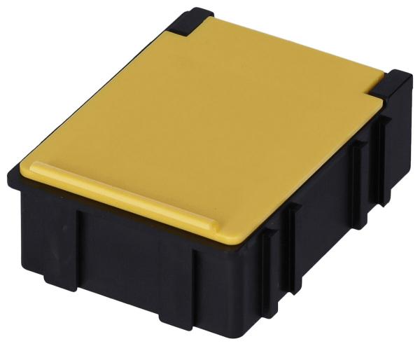 Das Bild zeigt eine rechteckige Box mit einem schwarzen Unterteil und einem gelben Deckel. Die Ecken sind abgerundet, und die Box hat eine flache Oberfläche mit einer leichten Erhöhung an der Oberseite.