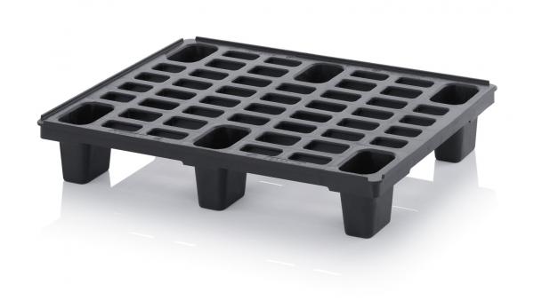 The image shows a black plastic pallet with a flat, rectangular design. It has many square and rectangular indentations for stability and easy handling.