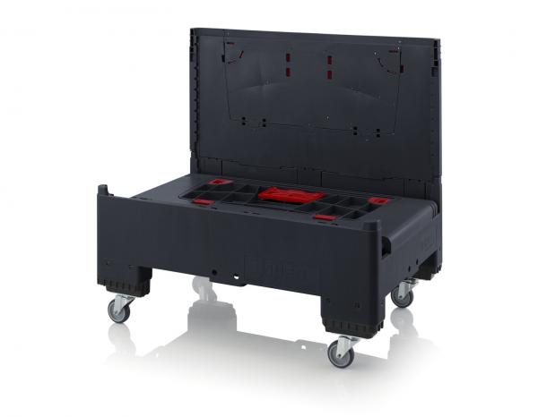The image shows a black transport box with a folding lid. The box has wheels for mobility and red interior compartments for organizing tools or equipment.