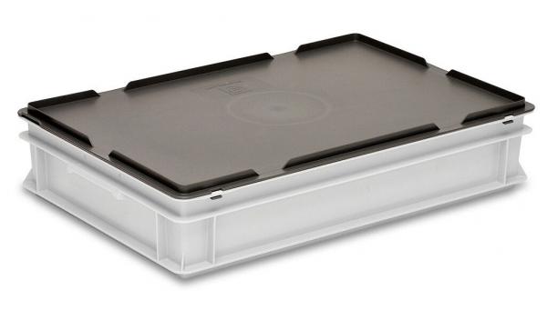 The image shows a rectangular, flat storage box. It has a transparent, glass bottom and a black, sturdy lid with side handles.