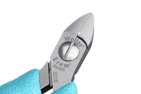 The image displays a narrow pair of pliers with a shiny, metallic cutting edge and a round handle. It features a light blue, rubberized grip for better hold.