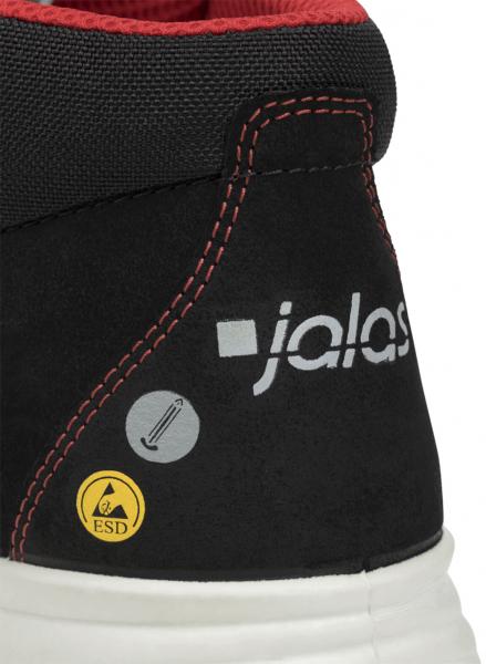 Das Bild zeigt den oberen Teil eines schwarzen Arbeitsschuhs mit roten Elementen. Ein Logo "jalas" ist sichtbar, sowie Sicherheitszeichen für ESD. Die Nähte sind sorgfältig verarbeitet.