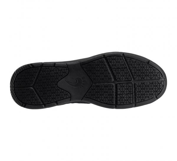 The image displays the sole of a black shoe. The surface is textured with various patterns and grooves, which provide good grip and flexibility.