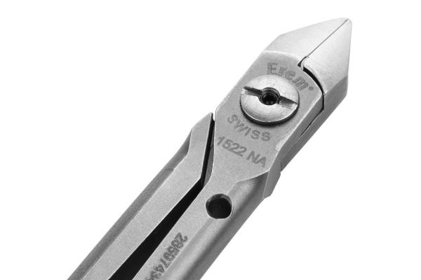 The image shows a silver pair of tongs with a pointed, sharp edge. It has a vertical screw in the middle and a smooth, metallic surface that slightly shines.