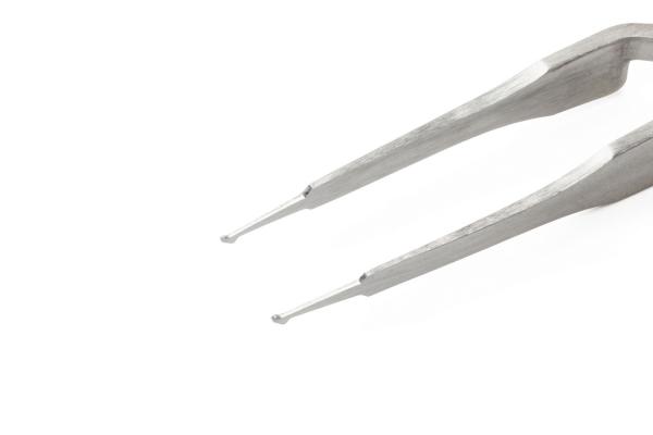 The image shows a pair of tweezers made of shiny metal. It has two narrow arms with pointed tips that can be opened and closed. The background is simple and bright.
