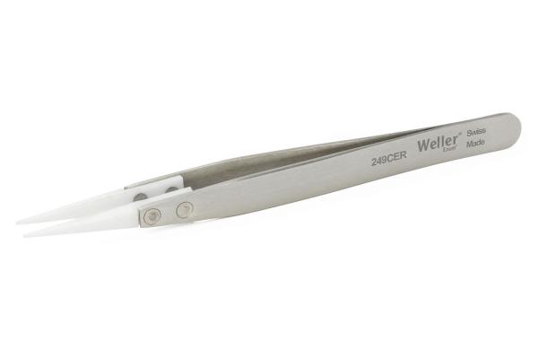 In the image, a stainless steel tweezer is visible. It features narrow, pointed tips and a gray handle with the inscription "Weller". The surface is smooth and shiny.