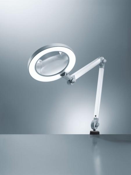 The image displays a feature-rich magnifying glass with light, mounted on a flexible, white arm. The round lamp edge ensures even illumination. The background is simple and bright.
