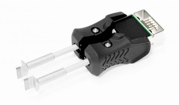 The image shows an adapter with two gripping handles and a USB port. The handles are made of black plastic, while the two ends are metallic and function like clamps.