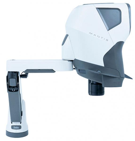 The image shows a white device with a compact, futuristic design. It has a movable arm structure and a lens-like component at the front, used for microscopic analyses.