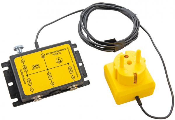 Das Bild zeigt ein elektrisches Gerät in gelber Farbe mit zwei Anschlüssen auf der linken Seite und einem Kabel, das zu einem gelben Stecker führt. Es hat eine rechteckige Form.