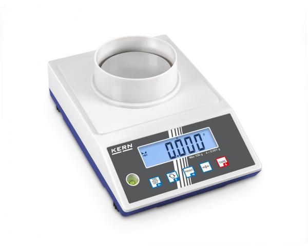 The image shows a digital laboratory scale with a round weighing platform in the middle and a large digital display. There are several buttons for operation.