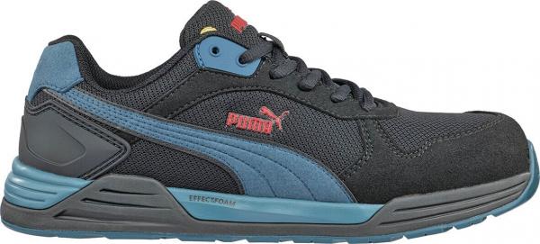 The shoe is black with blue accents. It has a sporty shape, a non-slip sole, and a padded tongue. A red Puma logo is attached to the side.